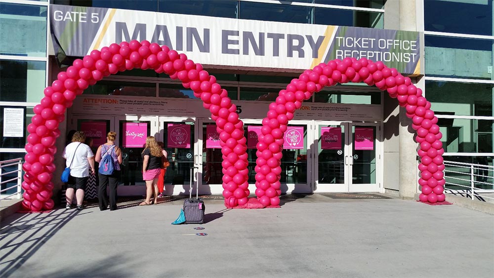 Pink balloon arches vivint arena