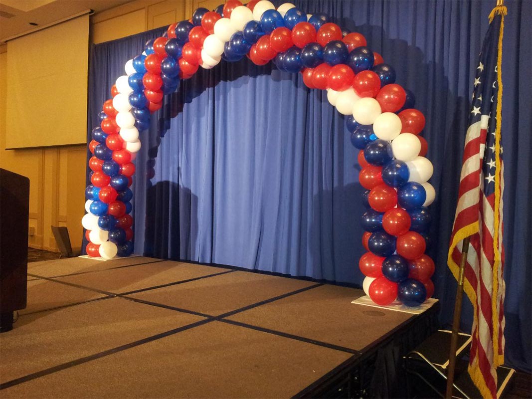 Red, white and blue stage arch